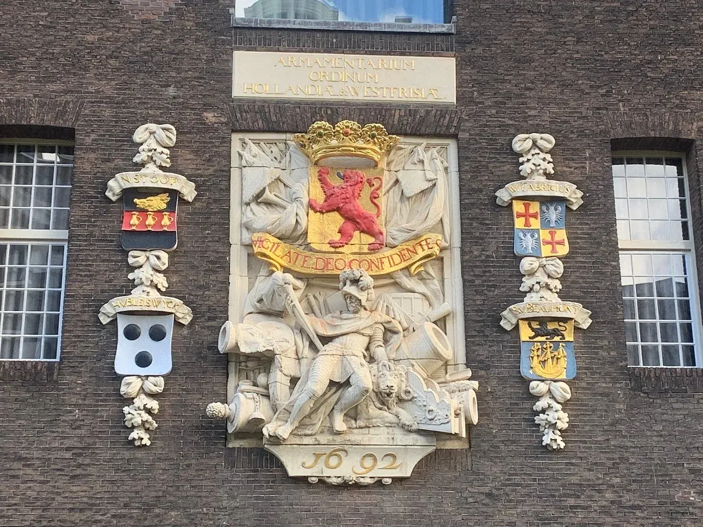 The 1692 facade relief with heraldic crests on the Armamentarium in Delft, a stop on the walking tour