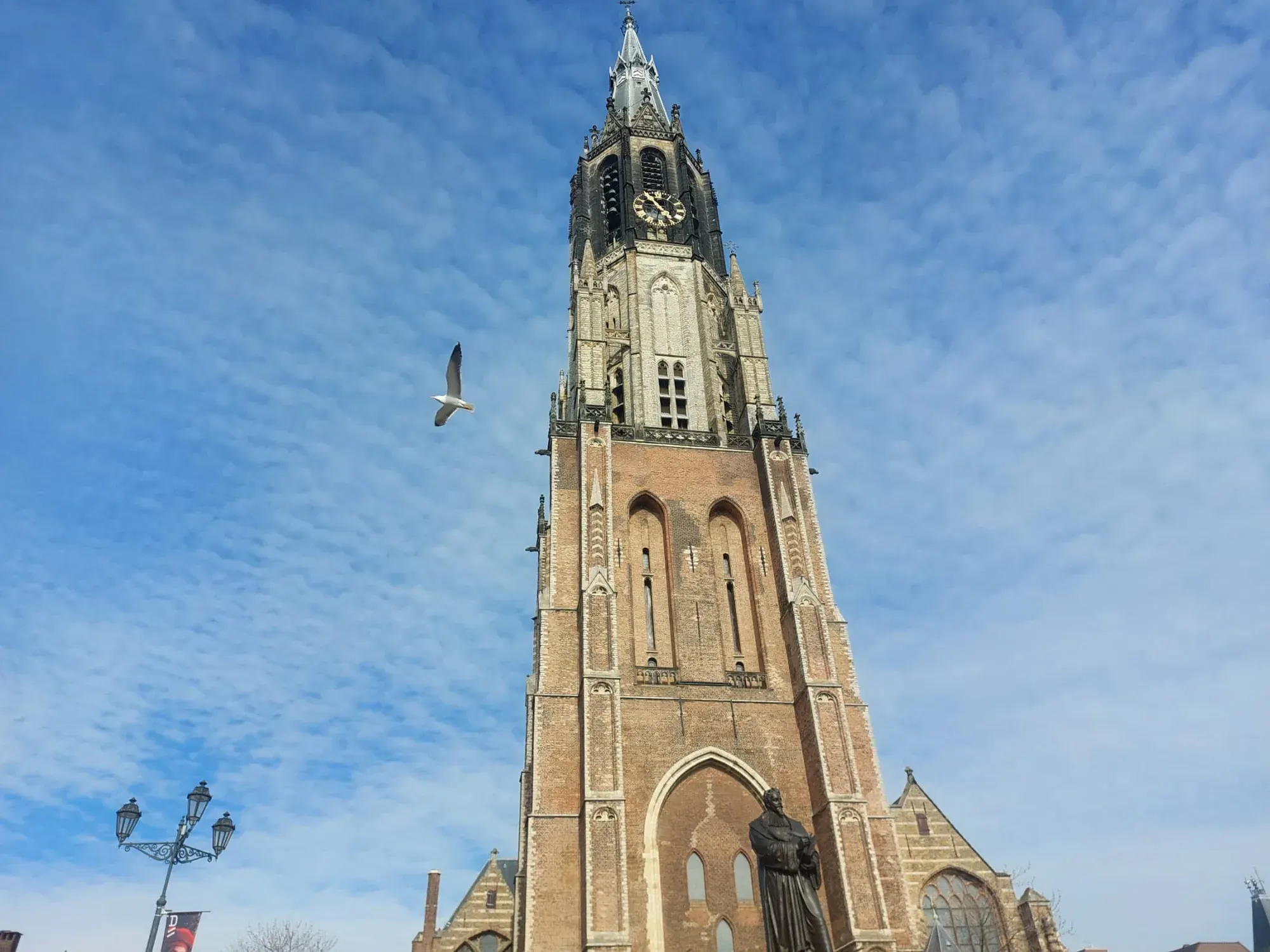 Close-up of the clock and spire of the Nieuwe Kerk on the Markt in Delft
